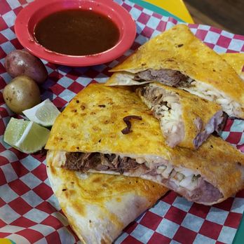 Faustinos Taqueria signature dishes Birria PizzaTamal RellenoBurrito Ahogados